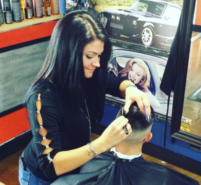 hairstylist doing fade haircut in southgate mi