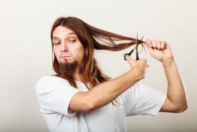 men trimming their own long hair